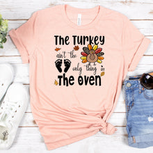 Load image into Gallery viewer, The Turkey Ain&#39;t The Only Thing In The Oven Bella Canvas Tee Shirt, Baby Announcement
