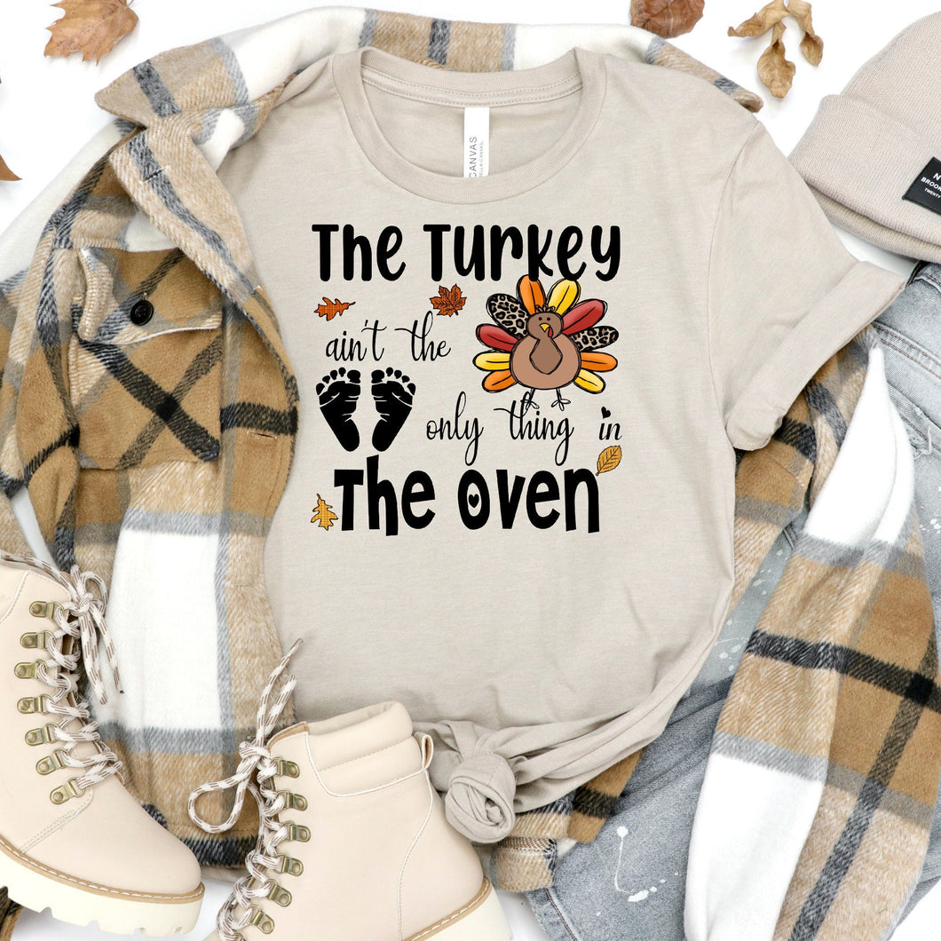 The Turkey Ain't The Only Thing In The Oven Bella Canvas Tee Shirt, Baby Announcement